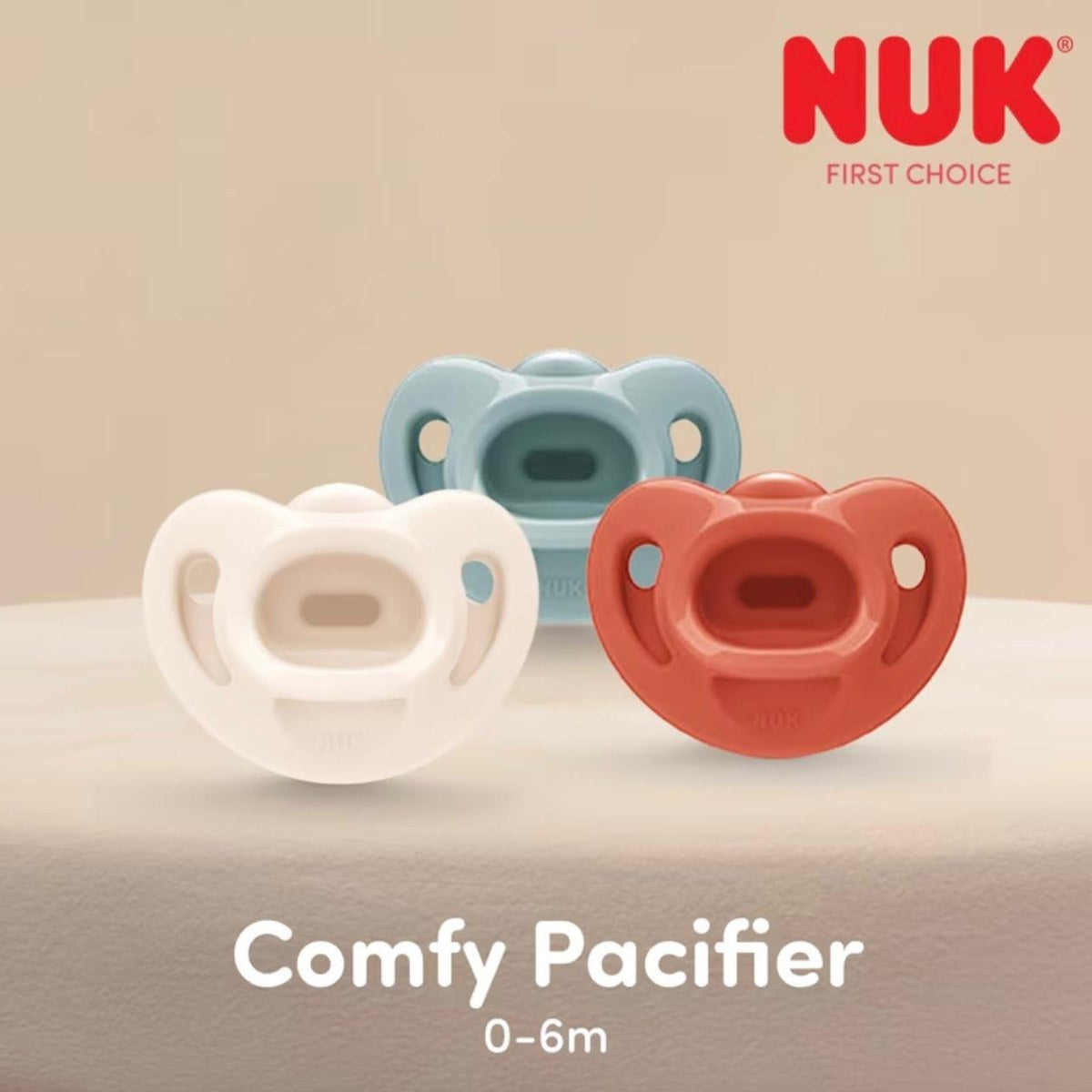 NUK Comfy Pacifier 0–6m, 3-pack — Blue-Grey, Cream & Rust