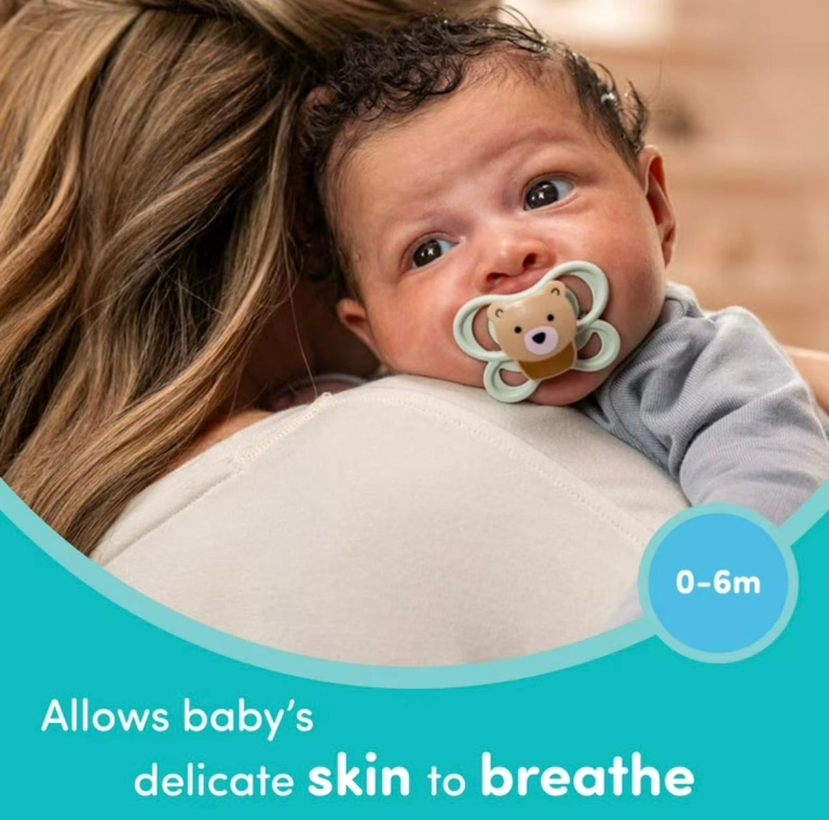 Baby with the NUK bear air pacifier