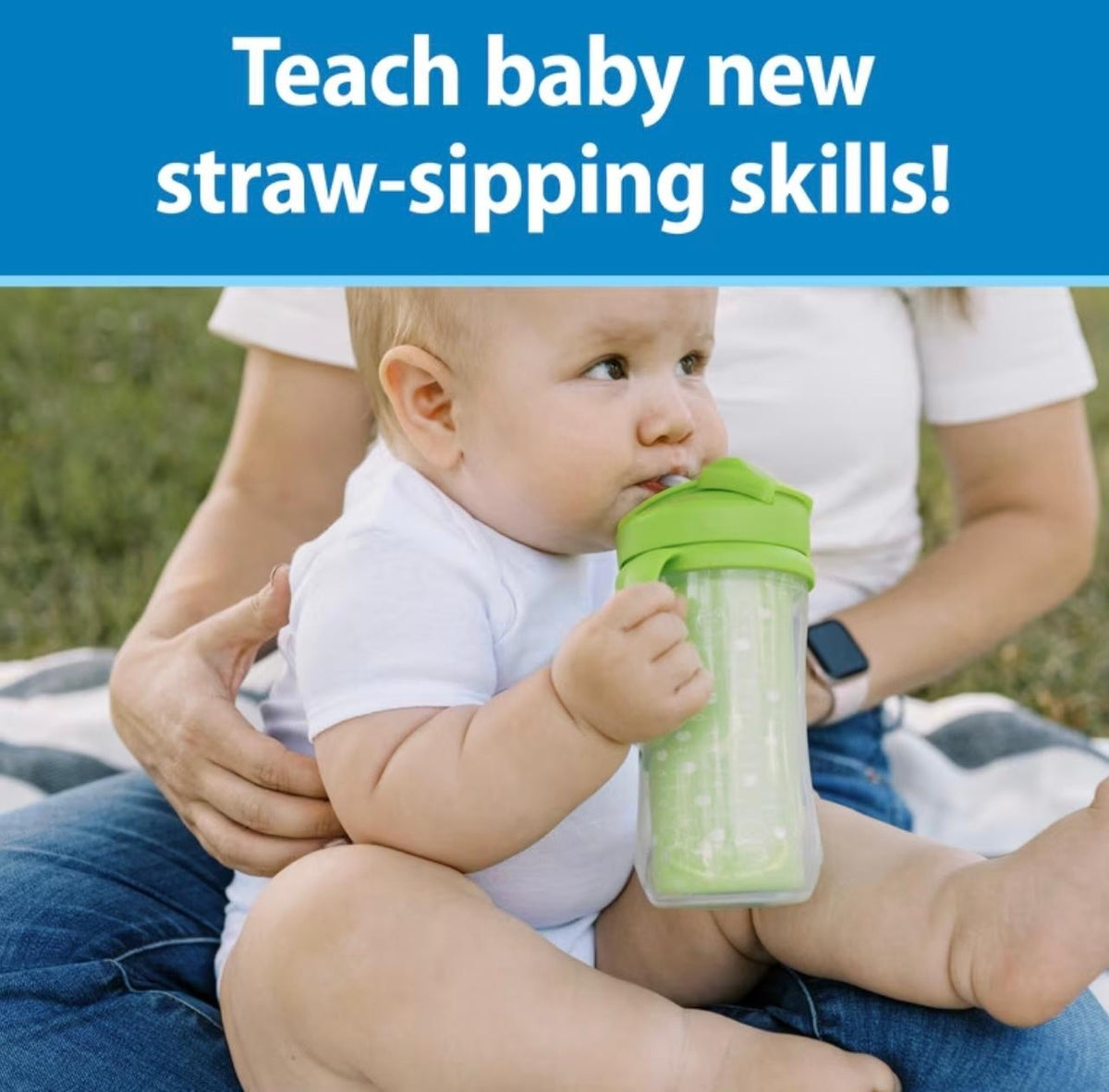 Baby drinking from the green straw cup